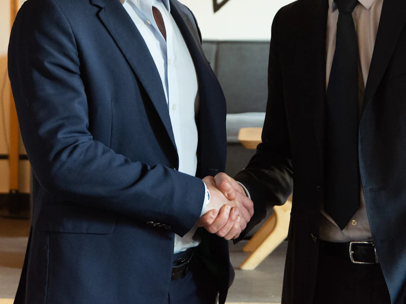 Two business partners shaking hands