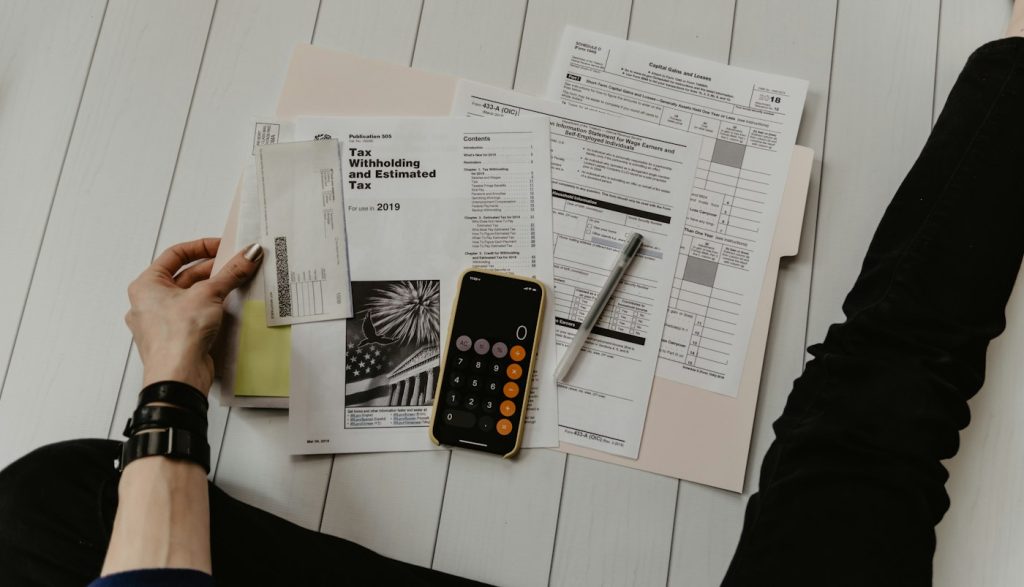 Signing a tax document at a desk